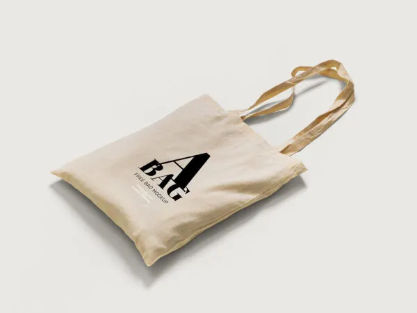 2 Mockups of Tote Bag Laid in Top and Perspective Views 1