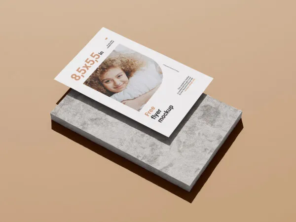 3 Mockups of Vertical Flyer on Flat Stone Piece 1