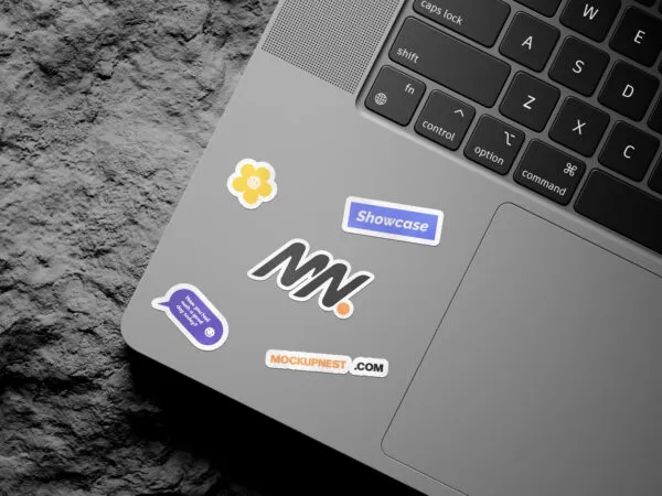 3 Shots of Laptop Sticker Mockup on Rock 1