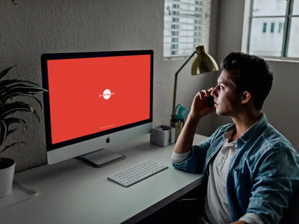 34 View Developer Using iMac Mockup Scene 1
