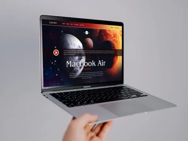 34 View Hand Holding MacBook Air Mockup 1
