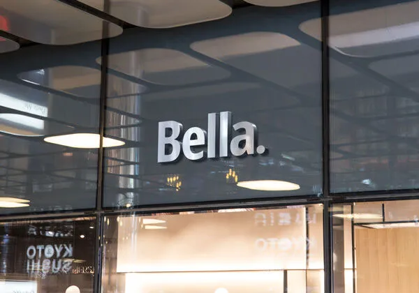 3D Silver Logo on a Glassy Facade Shop Mockup 1