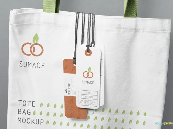4 Hanging Tags on a Tote Bag Mockup 1