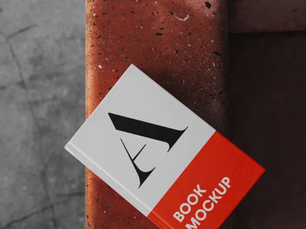 A Book Cover Mockup Sitting on a Bench 1