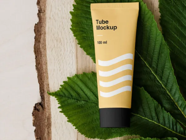 A Cosmetic Tube on Bunch of Leaves and a Piece of Wood Mockup 1
