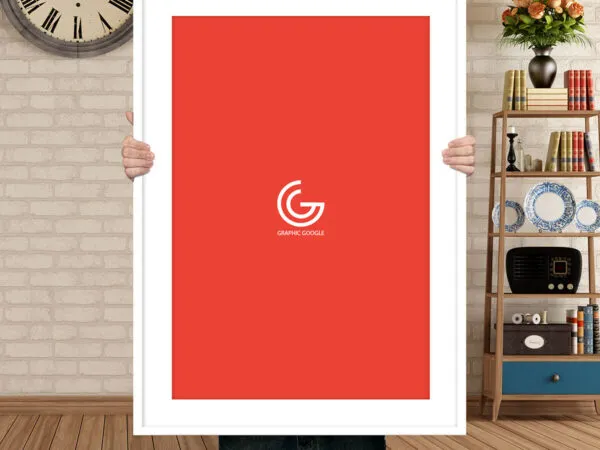 A Man Holding Up Poster in Front of Himself Mockup 1