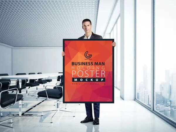 A Man Holding a Poster in an Office Mockup 1