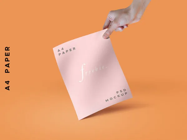 A Stylish Mockup of a Hand Holding a Paper or a Magazine 1