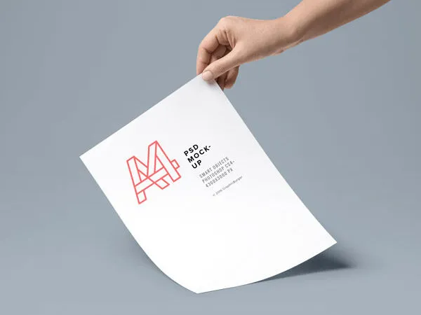 A4 Paper in a Hand Mockup 1
