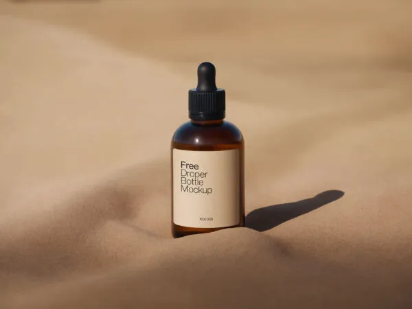 Amber Dropper Bottle Mockup with Sand Background 1