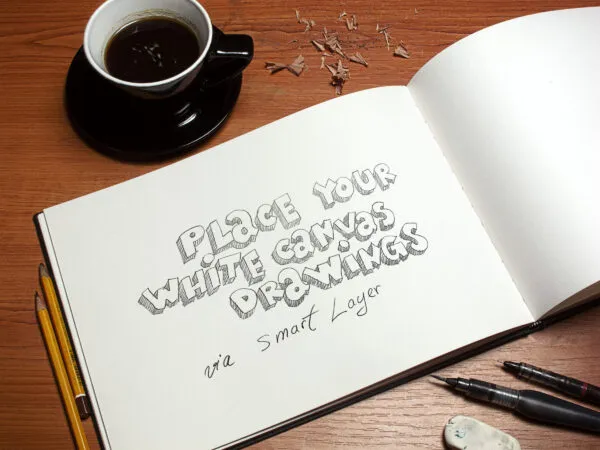 Art Book Mockup Featuring a Cup of Coffee and Pencils 1
