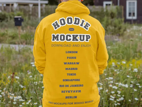 Back View of Man Wearing Oversize Hoodie Mockup in Garden 1