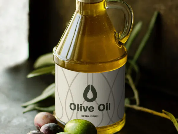 Bottle of Olive Oil with Olives in the Background Mockup 1