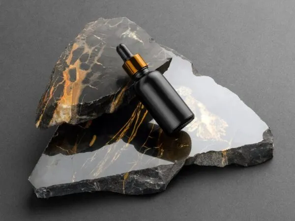 Bottle with Dripper Cosmetics Mockup on a Marble Stones 1