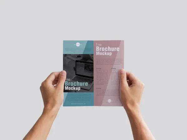 Brochure Holding by Hands in a Front View Mockup 1