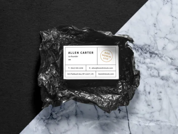Business Card Placed on Crumpled Black Plastic Mockup 1