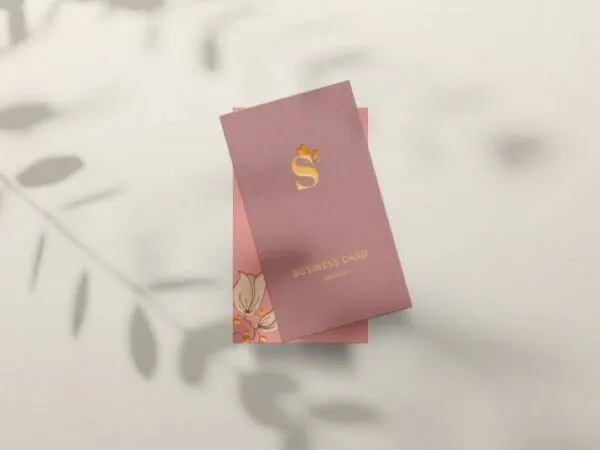 Business Card in Front of a Wall with Leaves Shadow Mockup 1