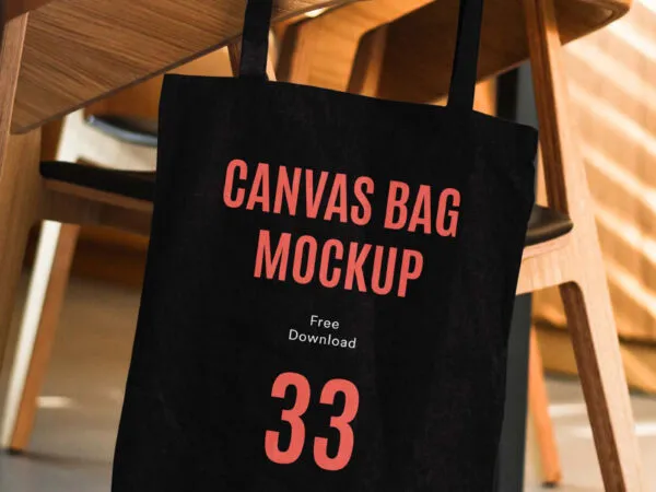 Canvas Bag Hanging on the Side of a Wooden Chair Mockup 1