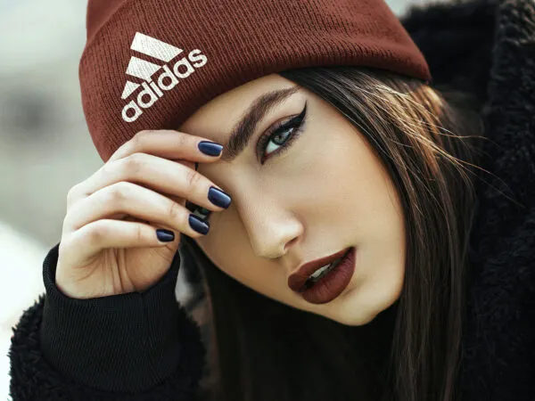 Close Up of a Girl Wearing Beanie Hat in the Half Side View Mockup 1