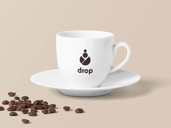 Coffee Cup Decorated with Poured Coffee Beans Mockup 1
