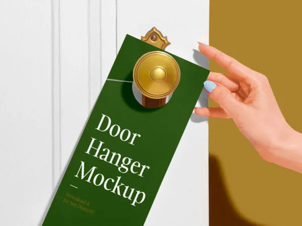 Door Hanger on a Wooden Door Besides a Womans Hand Mockup 1