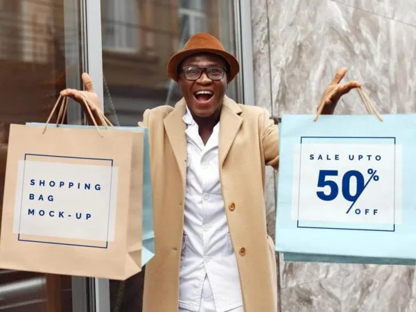 Excited Man Holding Shopping Bags Mockup 1