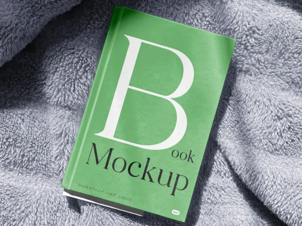 Facing View of Book Cover Mockup on Blanket 1 1
