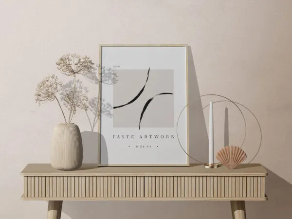 Facing View of Frame Mockup on Table with Decorative Plant 1