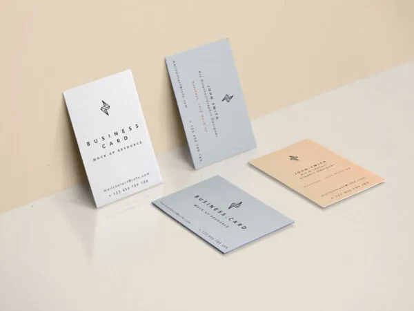 Four Business Cards Against Wall and Fitted on Floor Mockup 1