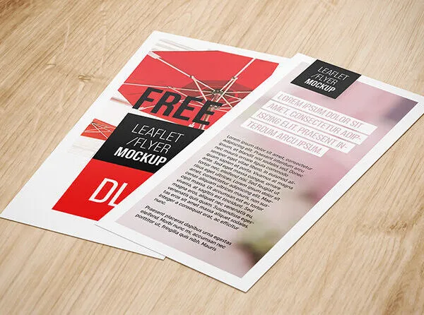 Four Mockups Featuring DL Flyers on Wooden Texture 1