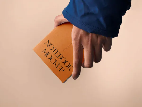 Front Sight of A5 Notebook Mockup in Hand 1