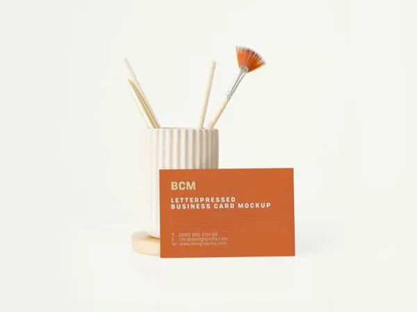 Front View Business Card Leaning Against Ceramic Brush Holder Mockup 1