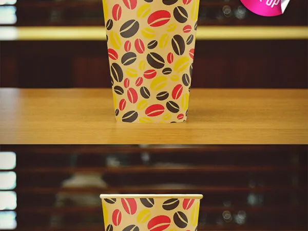 Front View Coffee Cup on Cafe Table Mockup 1