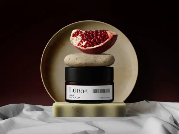Front View Cosmetic Jar Mockup with Stone and Pomegranate 1