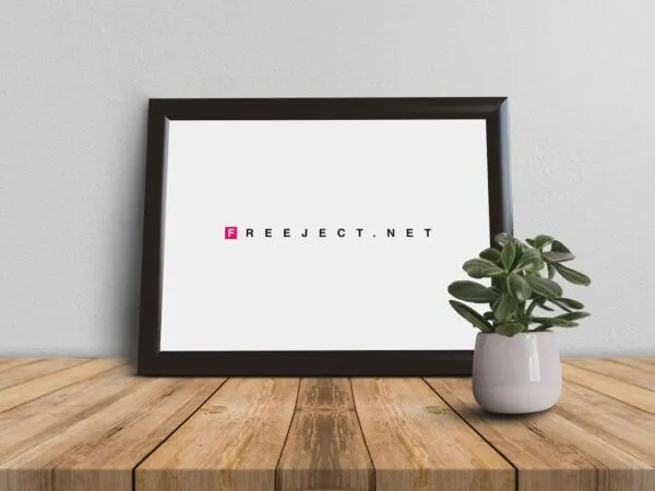 Front View Picture Frame on Wooden Table with Small Plant Mockup 1
