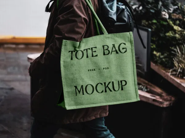 Front View of Eco Bag Mockup Carrying by Man 1