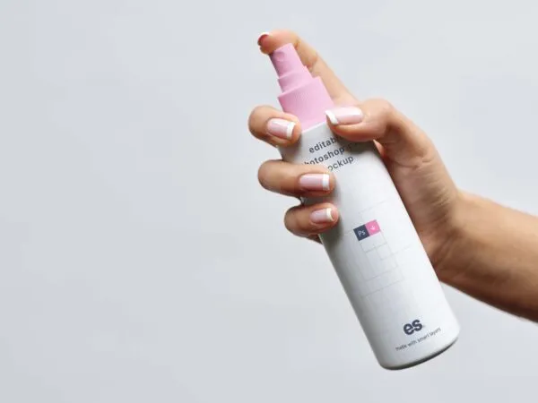 Front View of Hand Holding Lean Spray Bottle Mockup 1