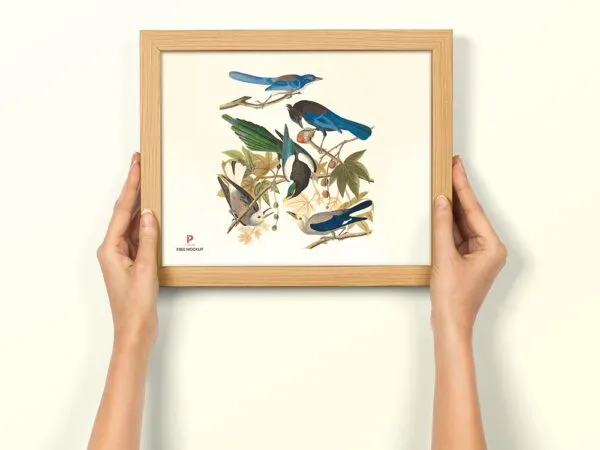 Front View of Hand Holding Photo Frame Mockup 1
