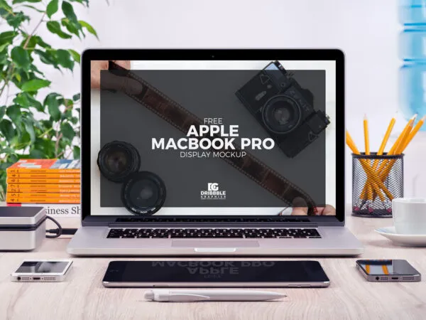 Front View of MacBook Pro and Stationery Items Mockup 1