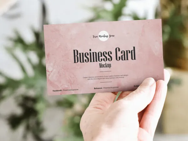 Front View of Mans Hand Showing a Business Card Mockup 1