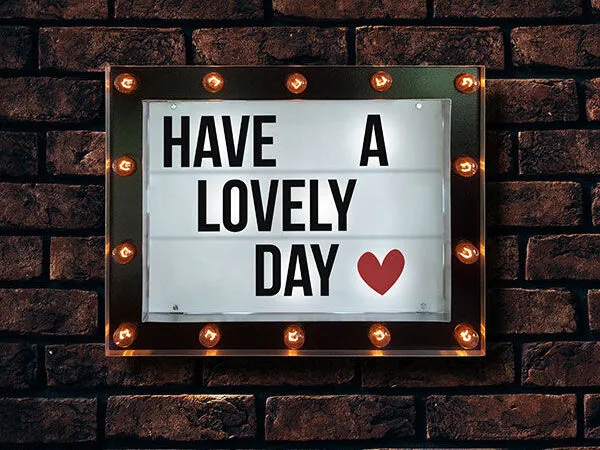 Front View of Marquee Cinema Lightbox on Brick Wall Mockup 1