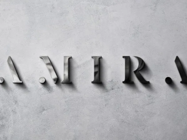 Front View of Polished Metal Sign Mockup on a Rough Wall 1