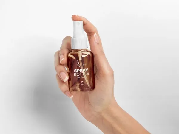 Front View of Woman Hand Holding Mini Spray Bottle Mockup 1