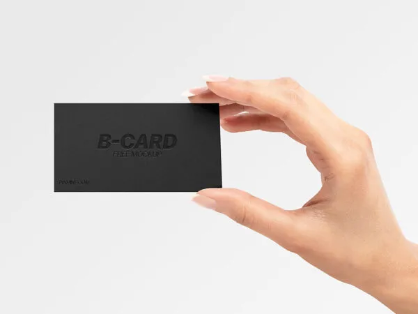 Front View of a Business Card Held Up by Hand Mockup 1