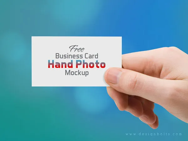 Front View of a Business Card Held Up by a Hand Mockup 1