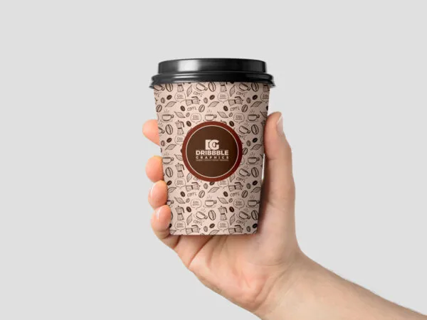 Front View of a Coffee Cup in Mans Hand Mockup 1