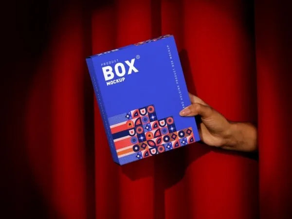 Front View of a Hand Holding a Product Box Mockup 1