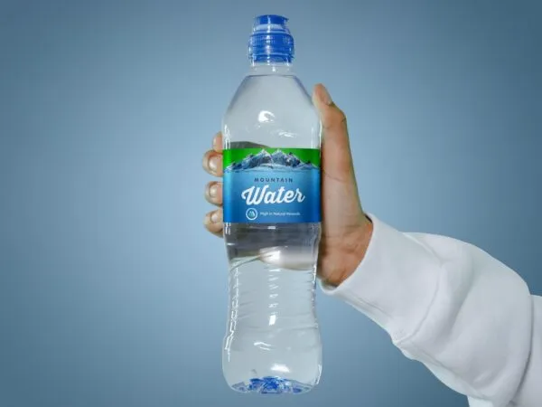 Front View of a Hand Holding a Water Bottle Mockup 1