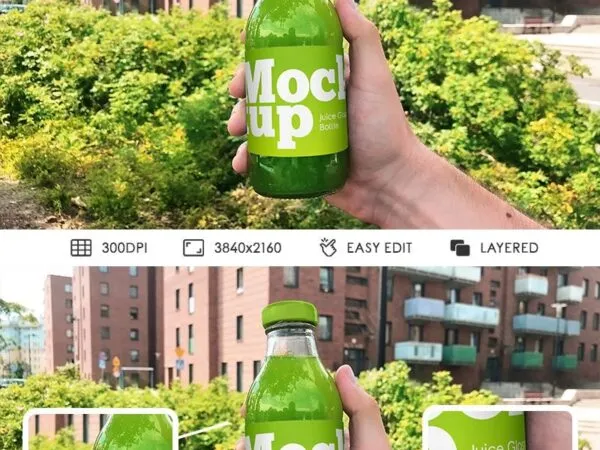 Front View of a Juice Glass Bottle Held Up by a Hand Mockup 1