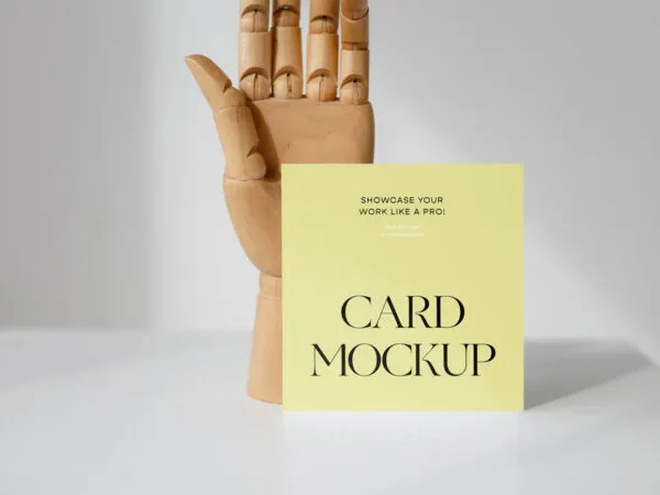 Front View of a Standing Card Mockup with a Wooden Hand 1
